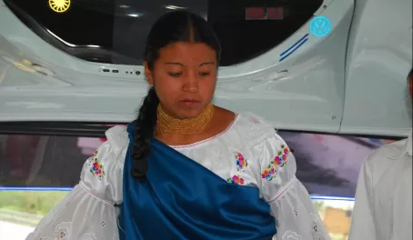 Young lady explaining the traditional dress of Ecuador.