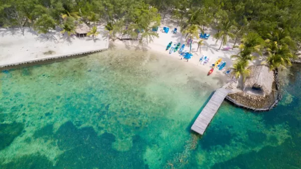 Enjoy water sports in Thatch Caye Resort