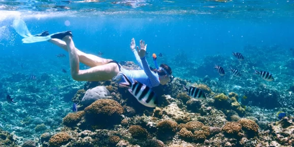 Snorkeling in crystal clear waters of Africa