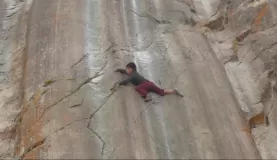 sliding down the rocks at Sacsayhuaman