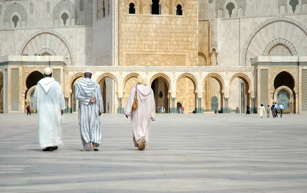 Locals walking around a city in Morocco.