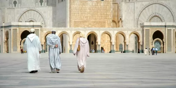 Locals walking around a city in Morocco.