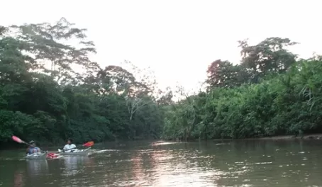 Arturo and Ã‘ame kayaking at sunset