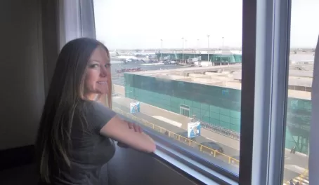 Ashley looks over the Lima airport from our hotel room