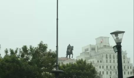 Statue rising from the fog in the center of Lima