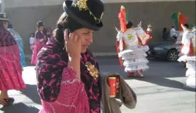 A local dancer with her cell phone & beer