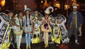 Walking in Cusco at night, dancers dressed in their finest.