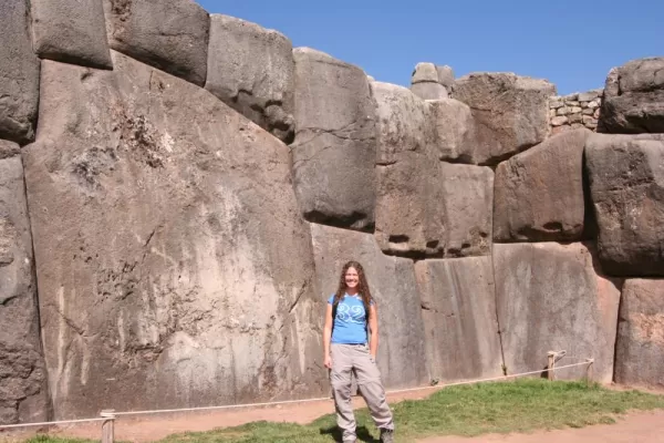 Pose by the massive stones of Sacsayhuaman on your Peru travels