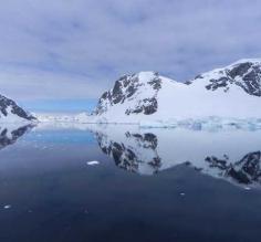 Prestine glass reflection on the waters of Antarctica