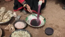Watching local women dye their yarn