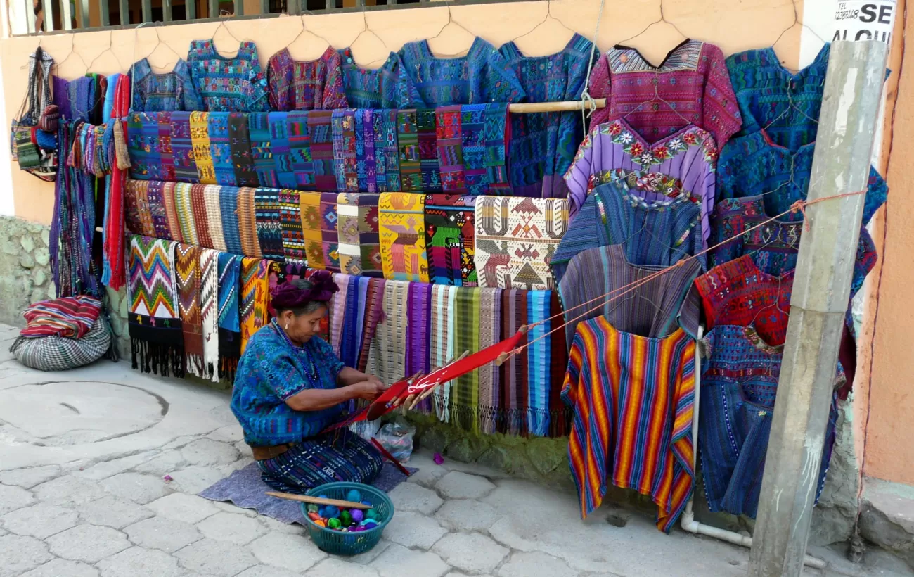 A local woman weaves beatiful textiles in Guatemala