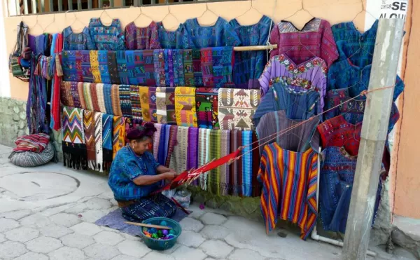 A local woman weaves beatiful textiles in Guatemala