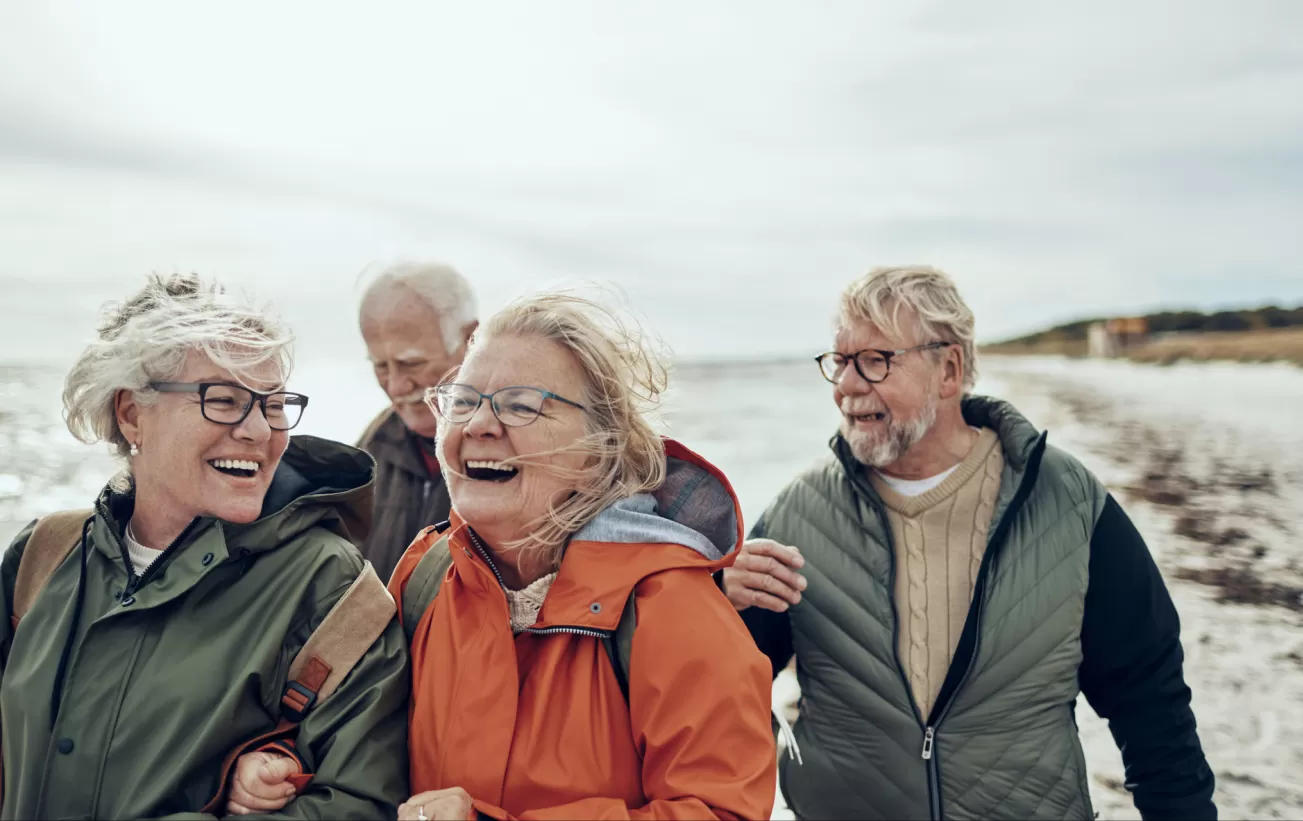 Group of middle-aged travelers on a coastal hike