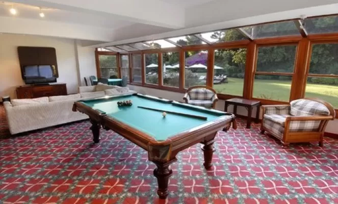 Enjoy some TV or play billiards in the game room