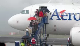 AeroGal issues umbrellas to arrivals
