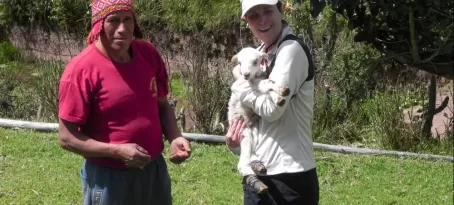 Francisco, our horse wrangler, and me with two-day old lamb