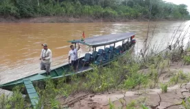 Our jungle boat; guide Pepe and his father