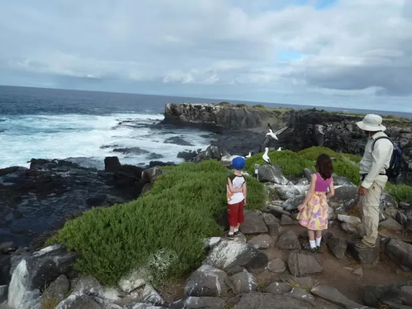 A family explores the shores of the Galapagos