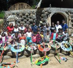 Students and volunteers in front of the school