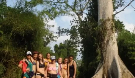 The girls taking a break in front of the Ceiba tree