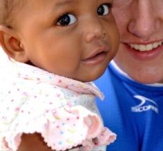 Monica makes a new friend volunteering at an orphanage