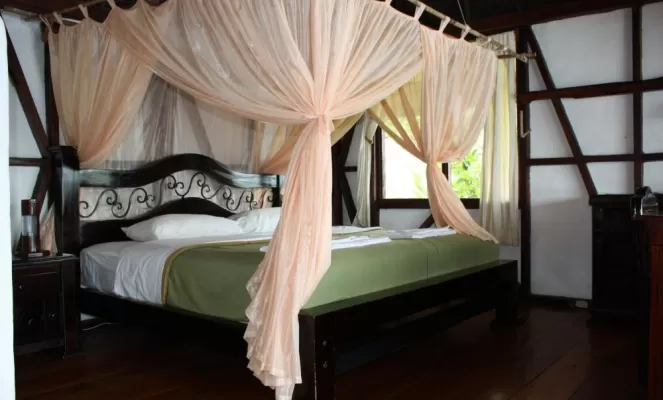 Luxury accommodations include a king and a twin bed in each cabana