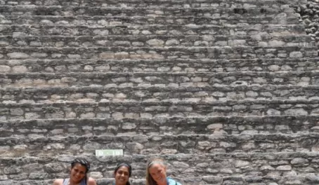 Girls on steps of Caracol Mayan Temple, Queens tomb