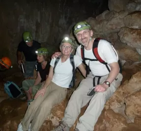All smiles exploring a cave in the Belizean jungle