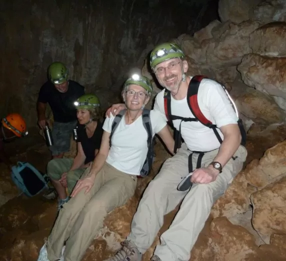 All smiles exploring a cave in the Belizean jungle