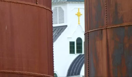 Grytviken chapel hides behind whale oil tanks