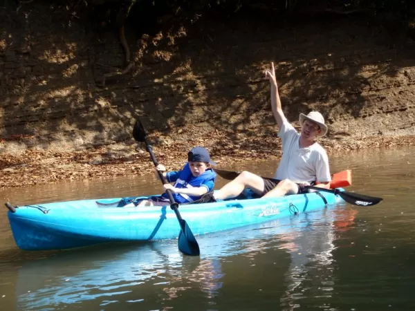 Family kayaking while staying at the Lodge at Big Falls