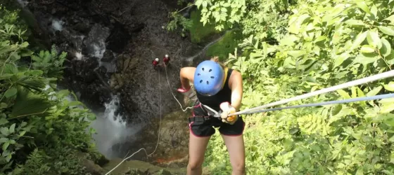 Rappelling waterfalls on a canyoning tour in Arenal
