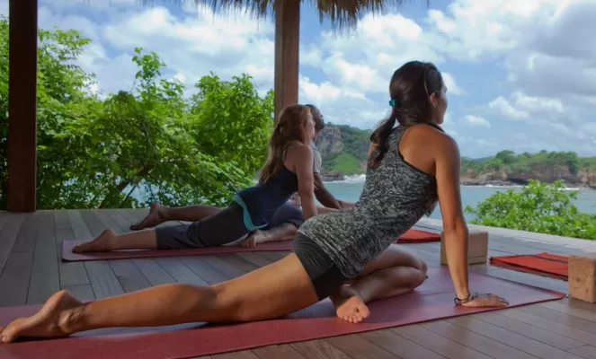 Exercise your mind and body from the yoga platform, overlooking white sand beaches