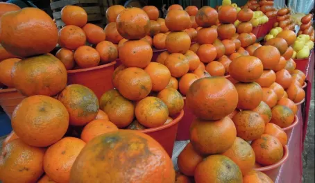 Oranges stacked at a market in Mexico