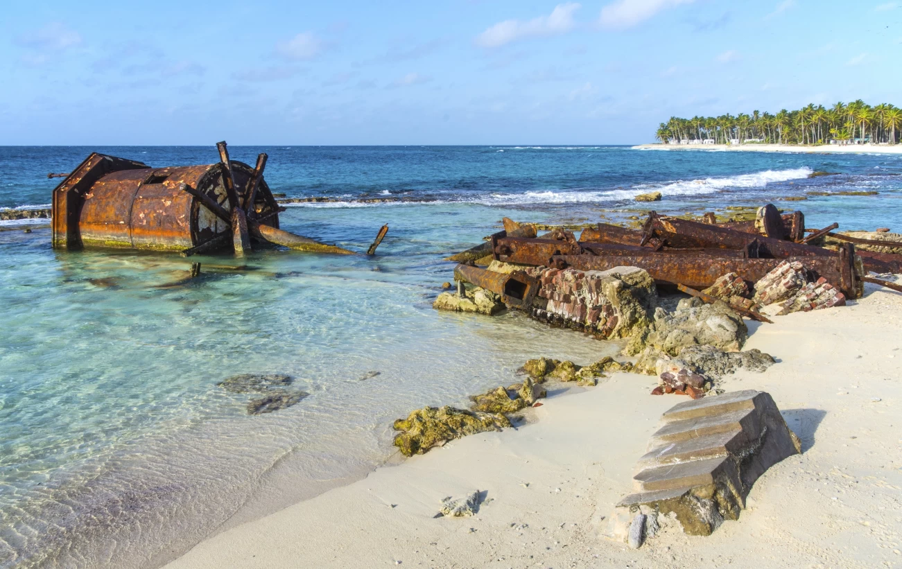 Rusting remains of the old lighthouse on Half Moon Caye, Lighthouse Reef Atoll, Belize Caribbean.