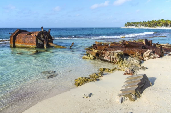 Rusting remains of the old lighthouse on Half Moon Caye, Lighthouse Reef Atoll, Belize Caribbean.