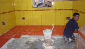 constructing the new bathroom floor at Mantay