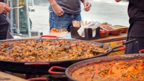 A street food vendor sells currys.
