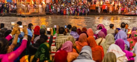 Hindu pilgrims gather in Haridwar for the evening Ganga Aarti to worship the Ganges.