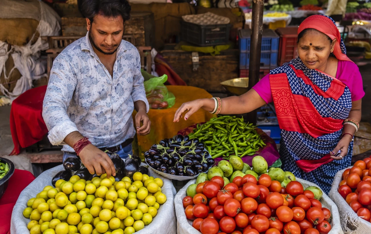Indian street sellers selling vegetables on the streets of The Pink City in Jaipur, Rajasthan, India