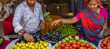 Indian street sellers selling vegetables on the streets of The Pink City in Jaipur, Rajasthan, India
