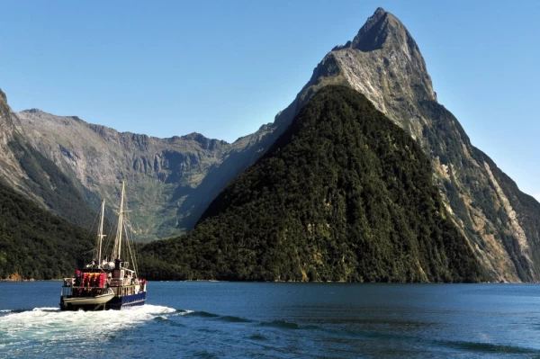 Ship sail under Mitre Peak in Fiordland National Park