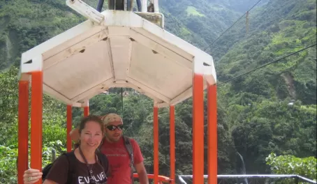 Julie and guide, Daniel, on the cable car in Banos