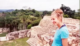 Beth at the top of a Maya ruin at Belizes Caracol