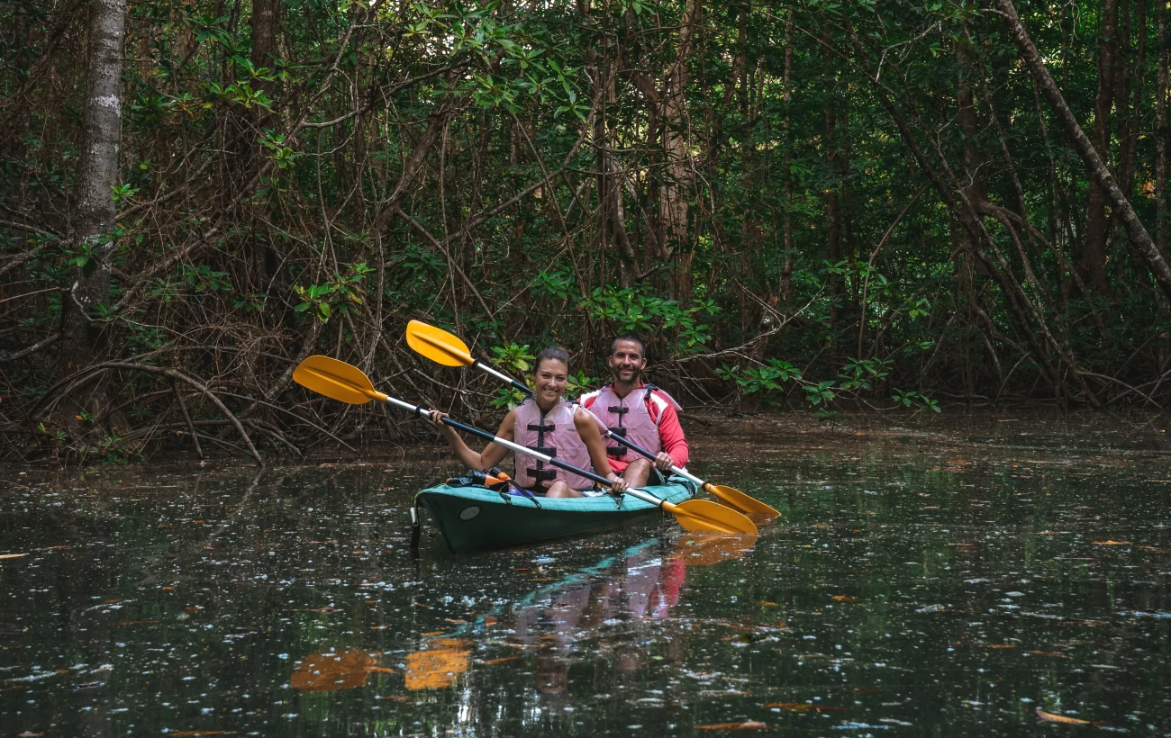 Happy couple kayaking in Corcovado National Park, Osa Peninsula