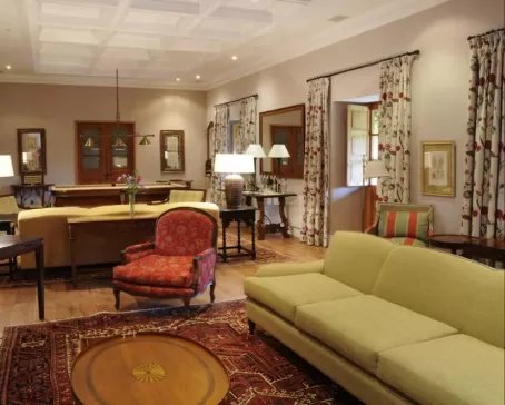Guests will enjoy lingering in the cozy reading living room with its pool table, chimney and honesty bar