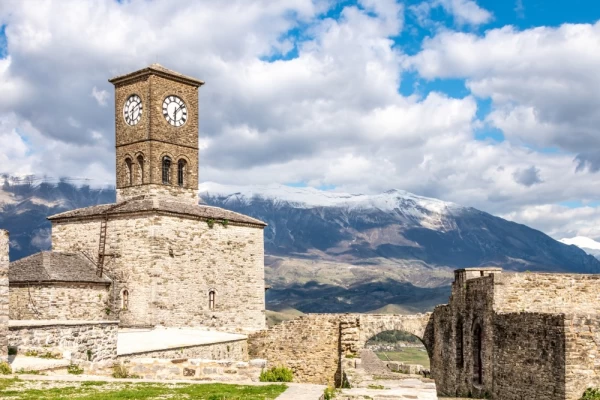 Clock Tower above Gjirokaster in Albania with Zagori Mountains in distance