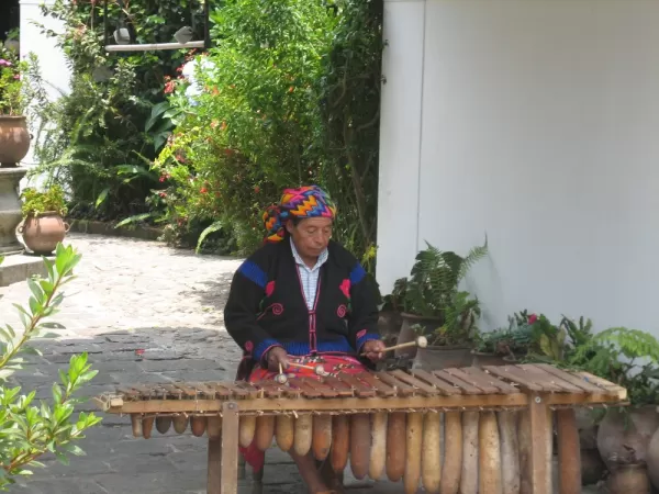 A local plays music in Guatemala