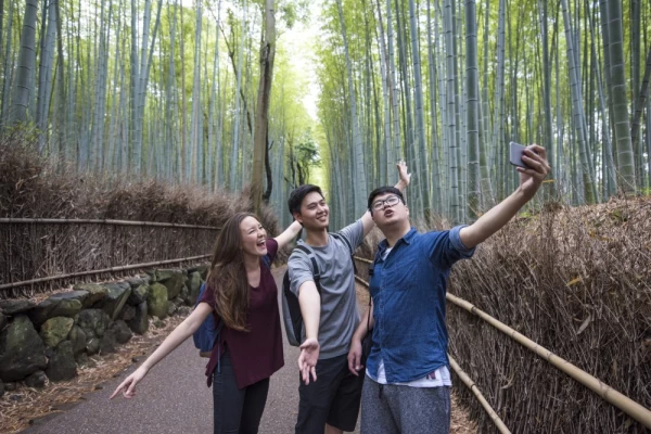 Taking a selfie in Arashiyama bamboo forest, Kyoto