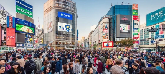 People crossing the crowded famous Shibuya Crossing in Downtown Tokyo